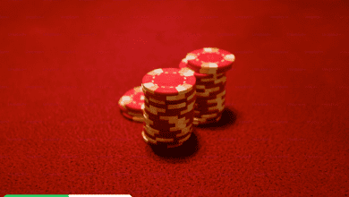 Red poker chips on a vibrant red background