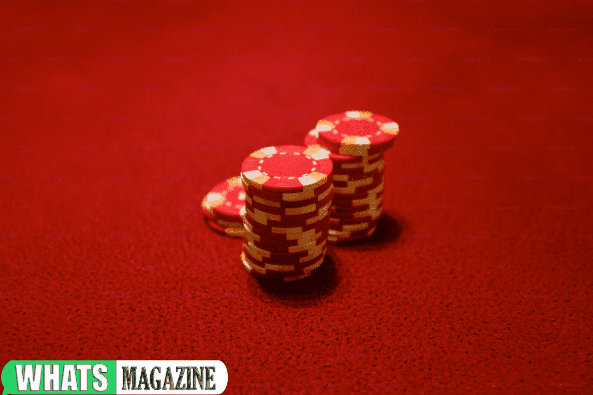 Red poker chips on a vibrant red background